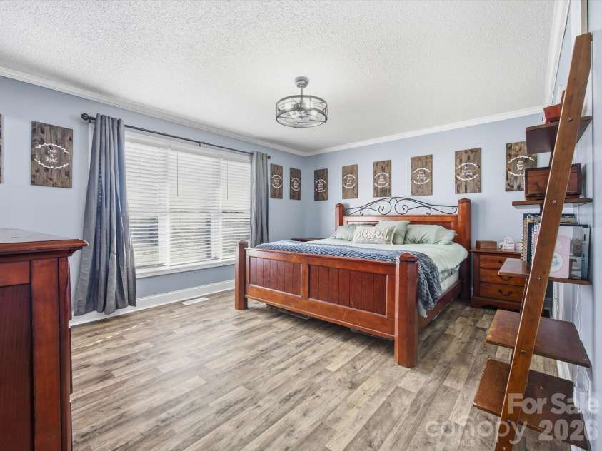 7580 Woodleaf Road, Woodleaf, NC 27054.  MLS# CAR4427833, YatesRealty ID 54012. Primary bedroom