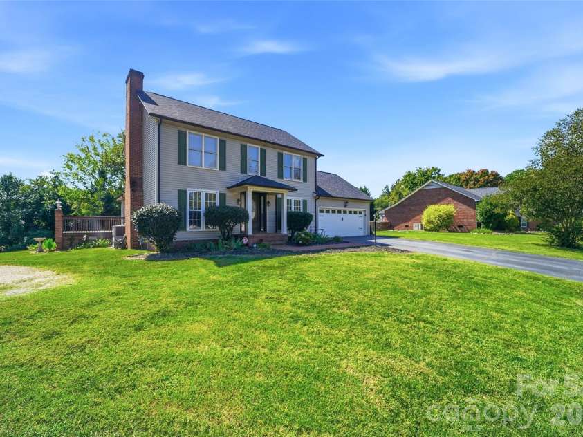 2351 Ellerbe Drive, Kannapolis, NC 28083.  MLS# CAR4430208, YatesRealty ID 54016. Front elevation with covered entry and brick chimney