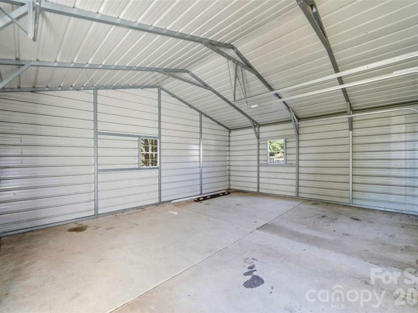 2351 Ellerbe Drive, Kannapolis, NC 28083.  MLS# CAR4430208, YatesRealty ID 54016. Inside the detached 2-car garage: concrete floor and open space