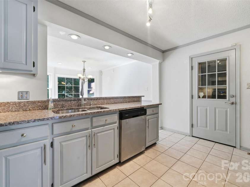 2351 Ellerbe Drive, Kannapolis, NC 28083.  MLS# CAR4430208, YatesRealty ID 54016. Kitchen with granite counters and dishwasher