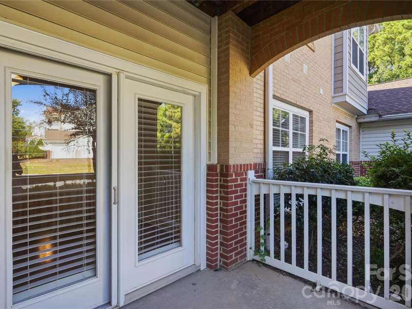 16406 Redstone Mountain Lane, Charlotte, NC 28277.  MLS# CAR4429830, YatesRealty ID 54019. Covered porch with storage room