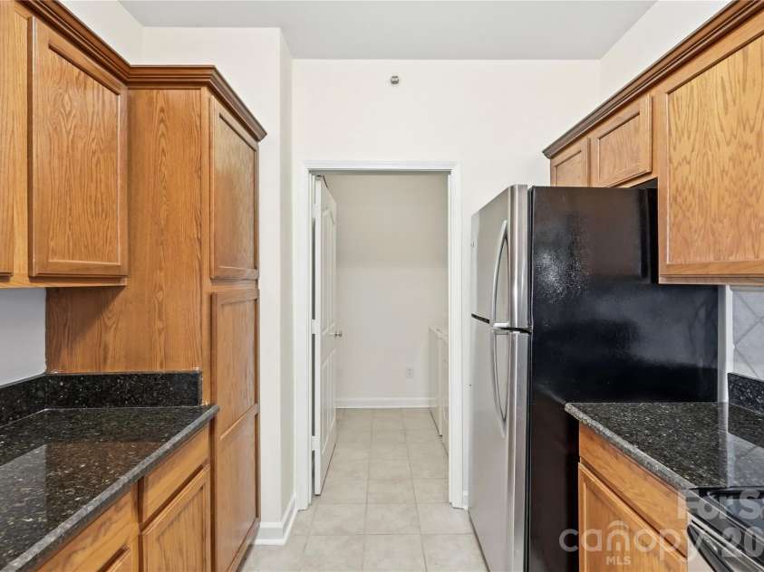 16406 Redstone Mountain Lane, Charlotte, NC 28277.  MLS# CAR4429830, YatesRealty ID 54019. Kitchen into the laundry room