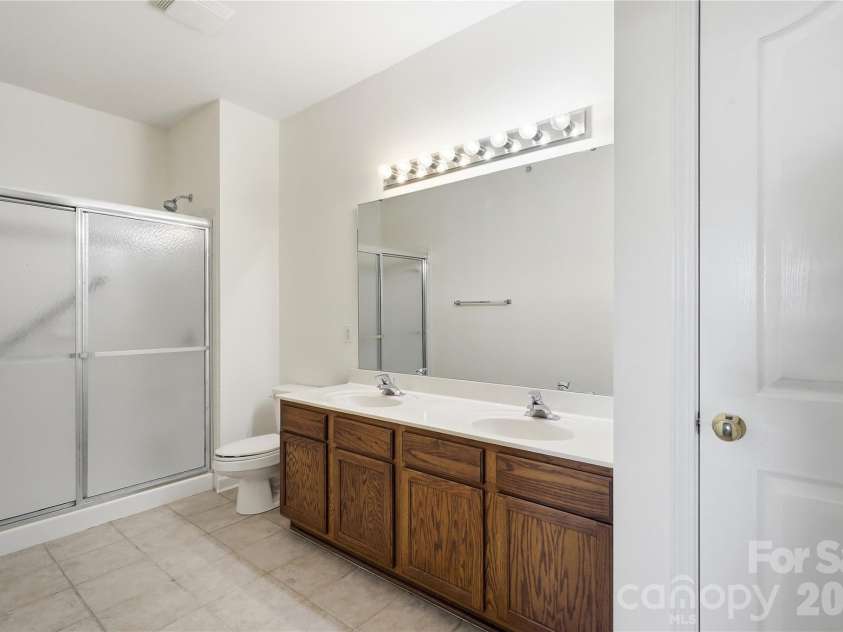 16406 Redstone Mountain Lane, Charlotte, NC 28277.  MLS# CAR4429830, YatesRealty ID 54019. Primary bath with walk-in shower and dual vanity