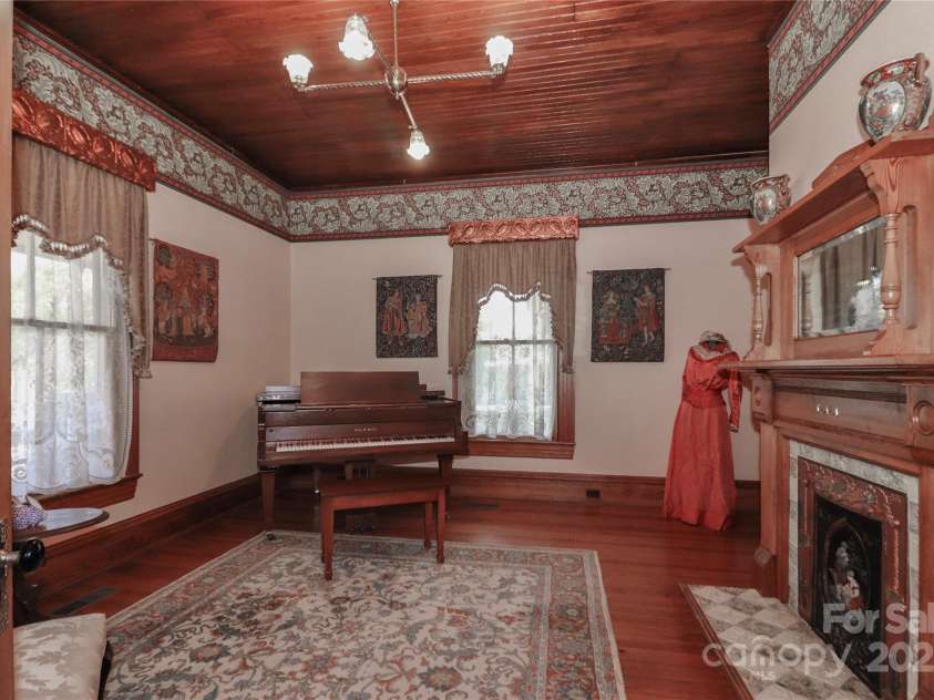 235 Walnut Street, Statesville, NC 28677.  MLS# CAR4134450, YatesRealty ID 5402. Front Parlor