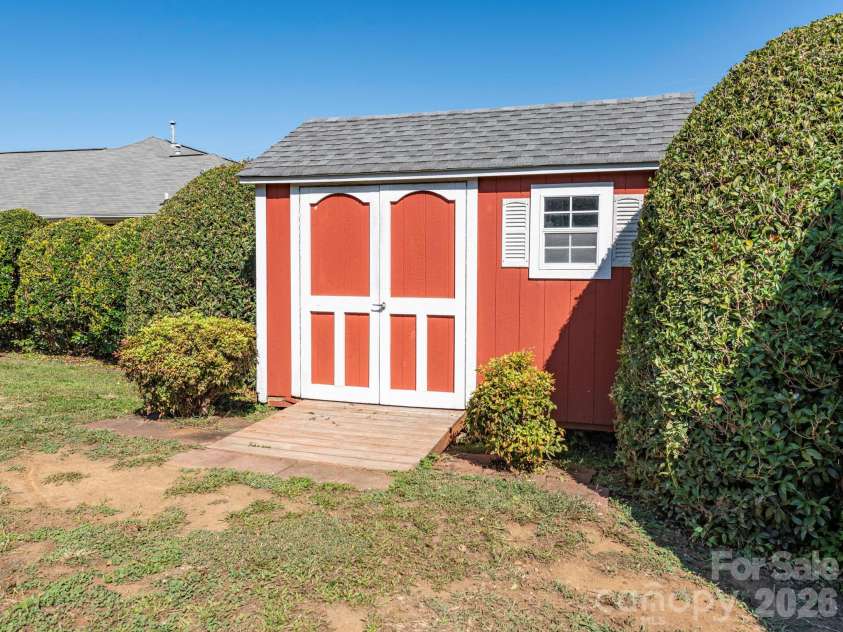 8415 Quail Hollow Drive, Harrisburg, NC 28075.  MLS# CAR4424111, YatesRealty ID 54022. 12 x 8 storage shed