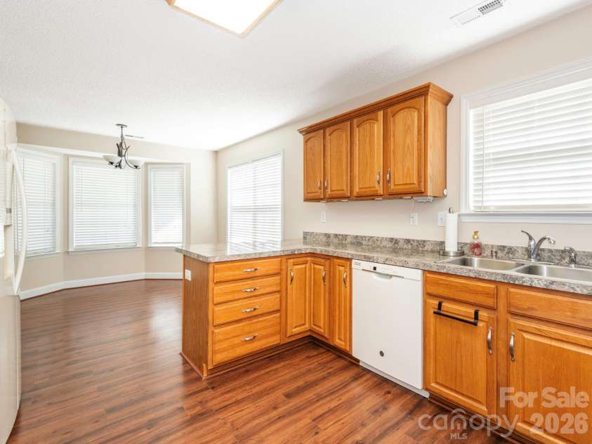 8415 Quail Hollow Drive, Harrisburg, NC 28075.  MLS# CAR4424111, YatesRealty ID 54022. Kitchen with abundant wood cabinet space