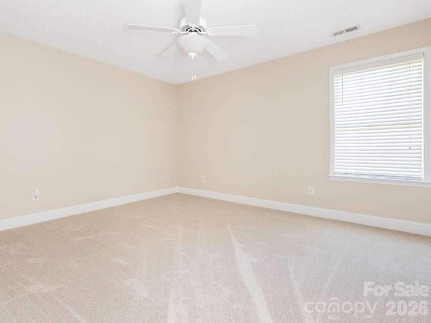 8415 Quail Hollow Drive, Harrisburg, NC 28075.  MLS# CAR4424111, YatesRealty ID 54022. Primary suite with ceiling fan