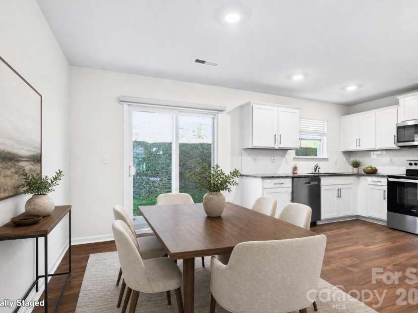 15 Virginia Commons Drive, Arden, NC 28704.  MLS# CAR4429383, YatesRealty ID 54035. Digitally Staged Dining Area