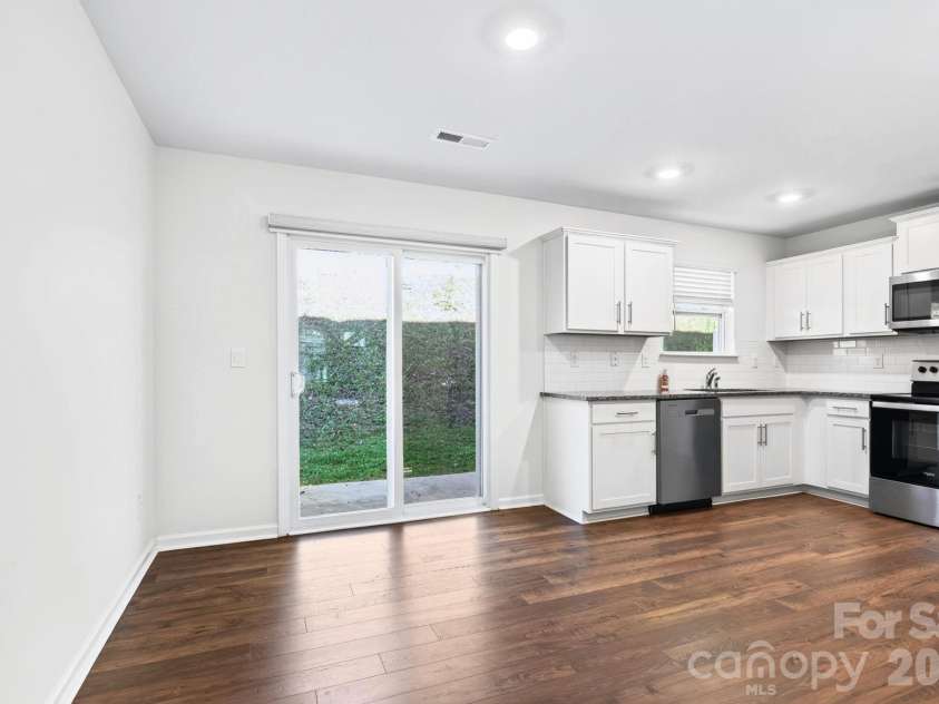 15 Virginia Commons Drive, Arden, NC 28704.  MLS# CAR4429383, YatesRealty ID 54035. Dining Area with Access to Patio