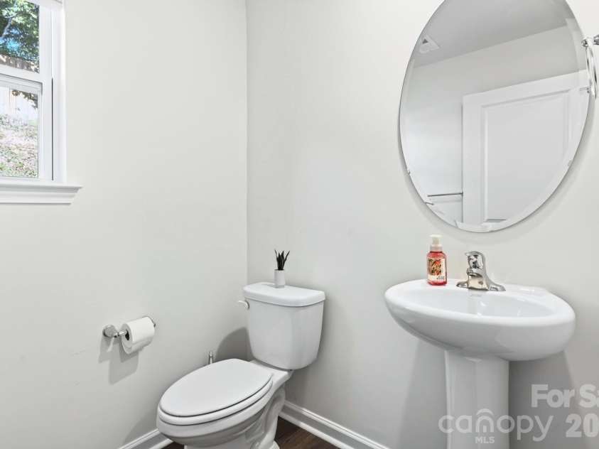 15 Virginia Commons Drive, Arden, NC 28704.  MLS# CAR4429383, YatesRealty ID 54035. Main-Level Half Bath off Laundry Room