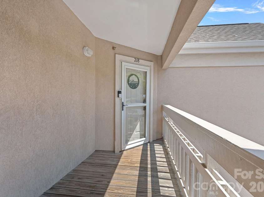 103 Pier 33 Drive, Mooresville, NC 28117.  MLS# CAR4403994, YatesRealty ID 54037. Entrance -3rd floor end unit