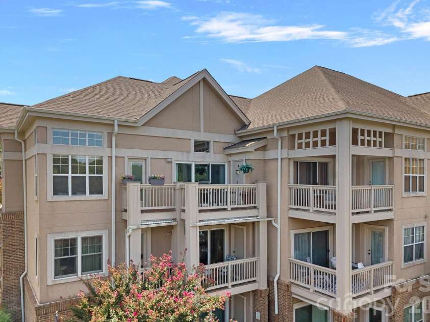103 Pier 33 Drive, Mooresville, NC 28117.  MLS# CAR4403994, YatesRealty ID 54037. Rear view of end unit condo- looking at 3rd floor deck/balcony