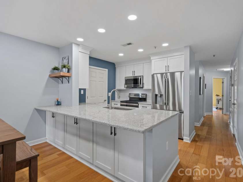 103 Pier 33 Drive, Mooresville, NC 28117.  MLS# CAR4403994, YatesRealty ID 54037. Updated Kitchen with Quartz Countertops, New SS appliances (2023)