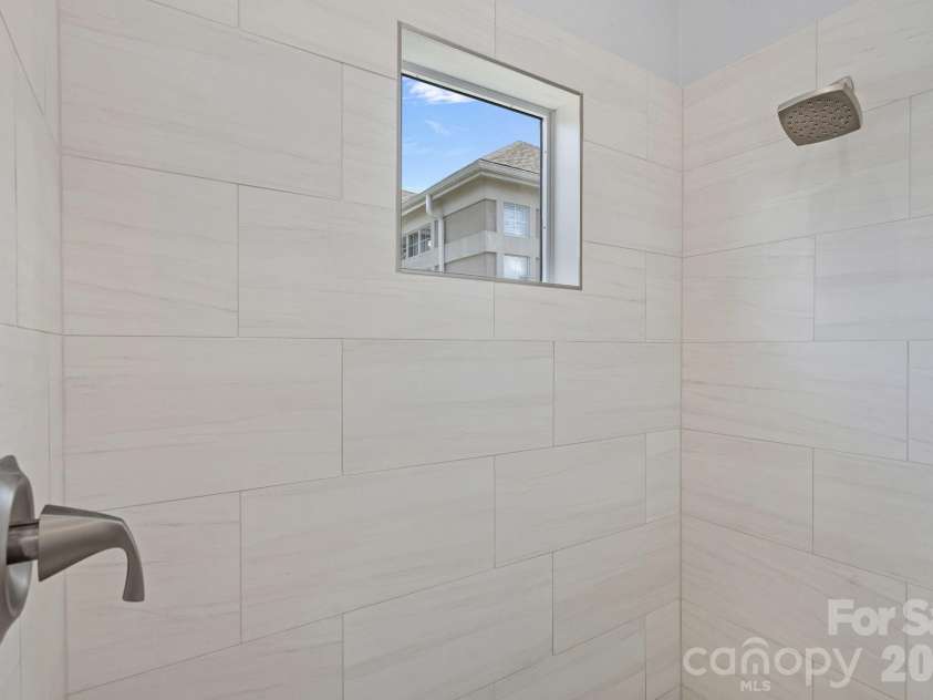 103 Pier 33 Drive, Mooresville, NC 28117.  MLS# CAR4403994, YatesRealty ID 54037. Updated Walk-In Tile Shower Surround