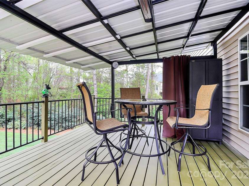 4086 Buckingham Drive, Fort Mill, SC 29707.  MLS# CAR4243764, YatesRealty ID 5404. Covered deck off kitchen/breakfast area with aluminum railing for low maintenance
