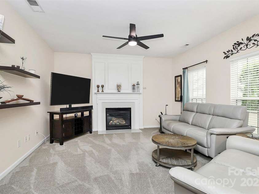4086 Buckingham Drive, Fort Mill, SC 29707.  MLS# CAR4243764, YatesRealty ID 5404. Family room a ceiling fan and gas logs