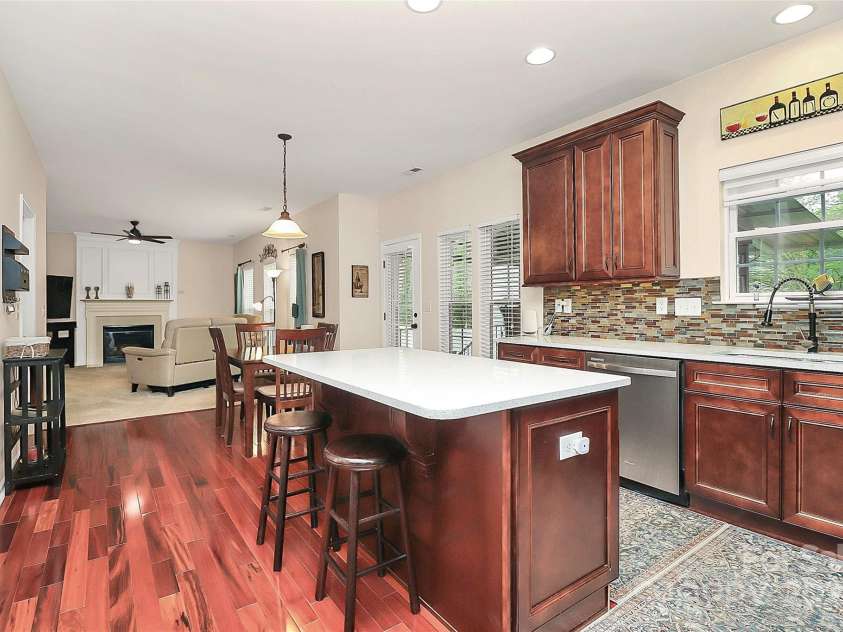 4086 Buckingham Drive, Fort Mill, SC 29707.  MLS# CAR4243764, YatesRealty ID 5404. Kitchen with island open to breakfast area and family room