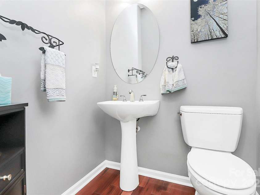 4086 Buckingham Drive, Fort Mill, SC 29707.  MLS# CAR4243764, YatesRealty ID 5404. Powder room on first floor with engineered hardwood floors