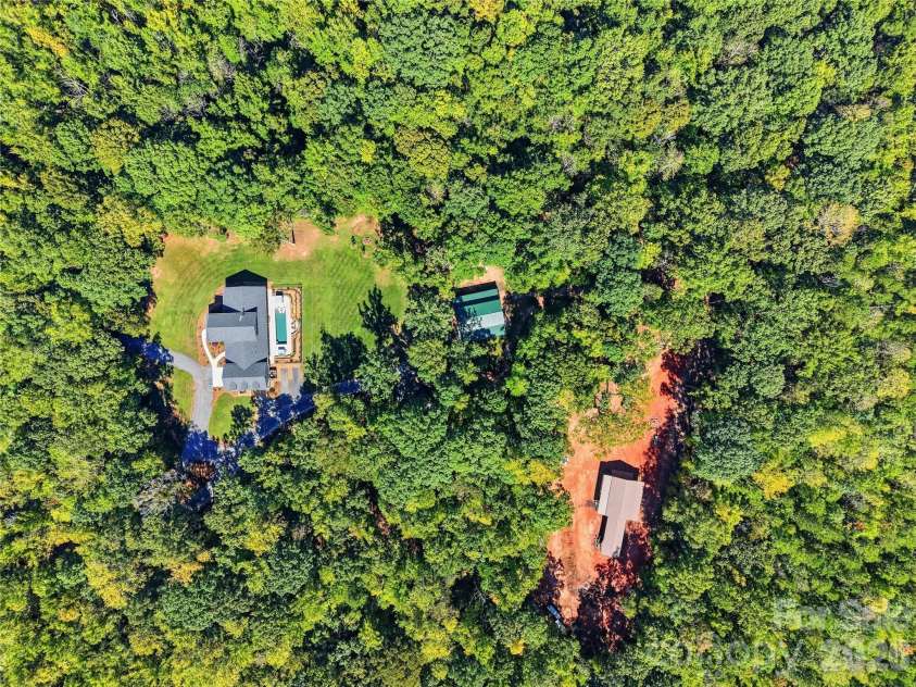 317 Windmill Lane, Waxhaw, NC 28173.  MLS# CAR4429362, YatesRealty ID 54041. Expansive 12.77 acreage both cleared with home and pole barn outbuildings