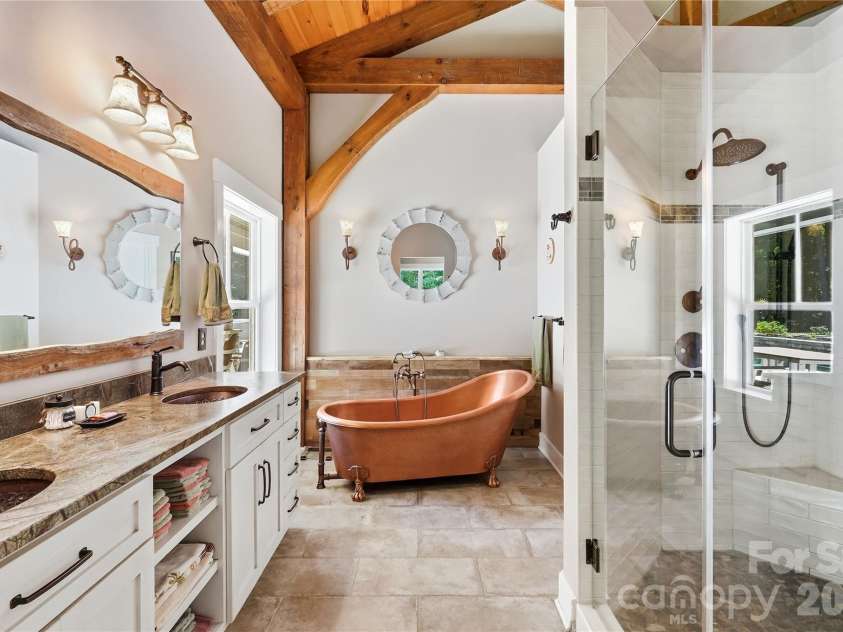 317 Windmill Lane, Waxhaw, NC 28173.  MLS# CAR4429362, YatesRealty ID 54041. The copper soaking tub and beautifully quartzite counters make this a welcoming feature