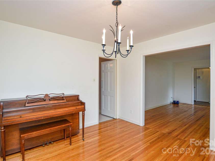 2429 Sugar Mill Road, Charlotte, NC 28210.  MLS# CAR4245721, YatesRealty ID 5405. Another view of the Dining Room looking towards the Living Room showing the classic hardwood floors that flow into the other room.