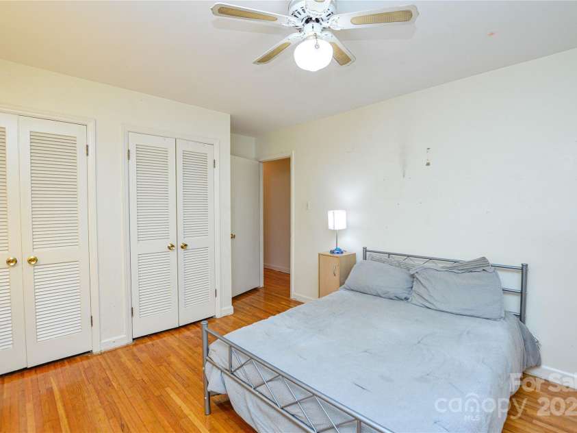 2429 Sugar Mill Road, Charlotte, NC 28210.  MLS# CAR4245721, YatesRealty ID 5405. Another view of the Second Bedroom showing TWO Closets, ceiling fan and hardwood floors.