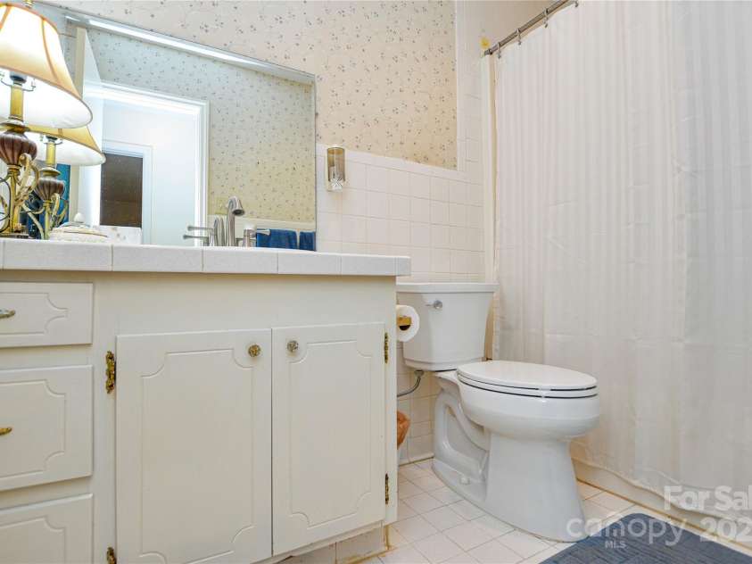 2429 Sugar Mill Road, Charlotte, NC 28210.  MLS# CAR4245721, YatesRealty ID 5405. Hall bathroom has upgraded dual-flush commode and vanity.