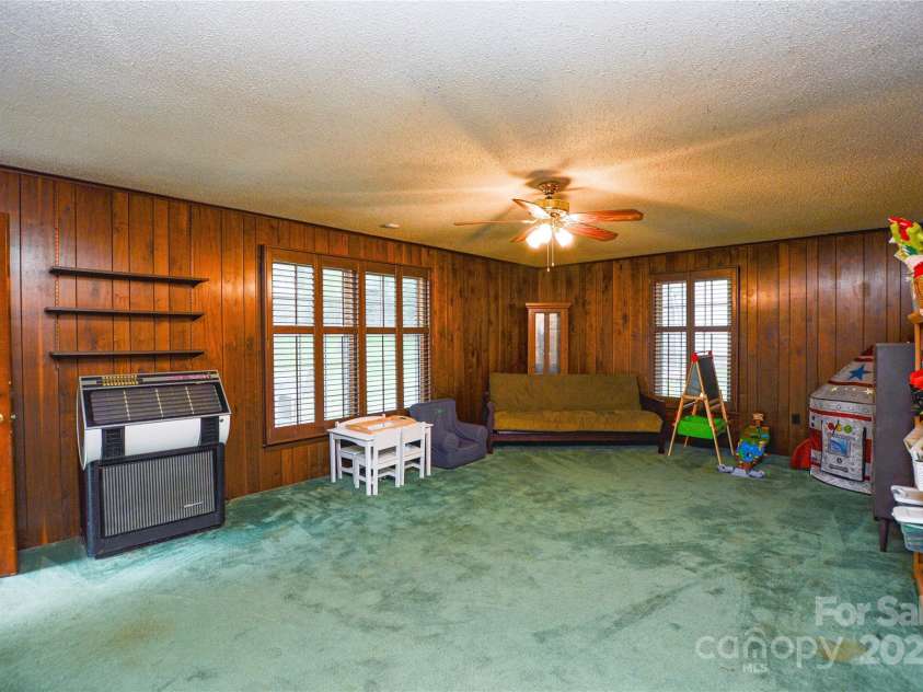 2429 Sugar Mill Road, Charlotte, NC 28210.  MLS# CAR4245721, YatesRealty ID 5405. HUGE Recreation room has heavy-duty carpeting, ceiling fan, many windows, and plenty of room for activites!