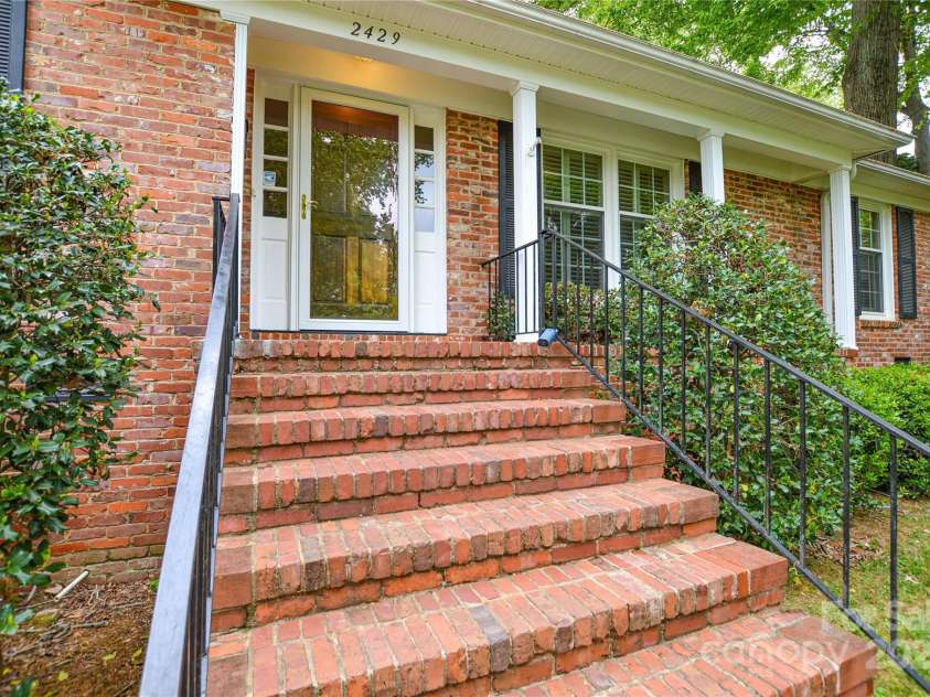 2429 Sugar Mill Road, Charlotte, NC 28210.  MLS# CAR4245721, YatesRealty ID 5405. View looking at the stairs, porch and front entrance.