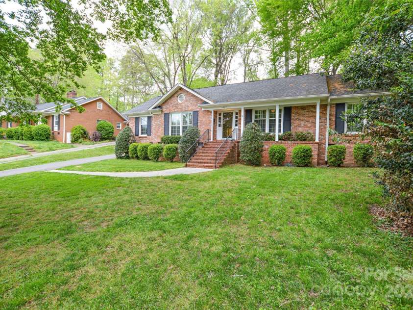 2429 Sugar Mill Road, Charlotte, NC 28210.  MLS# CAR4245721, YatesRealty ID 5405. View looking from the right front of the property showing the large front yard and mature landscaping.