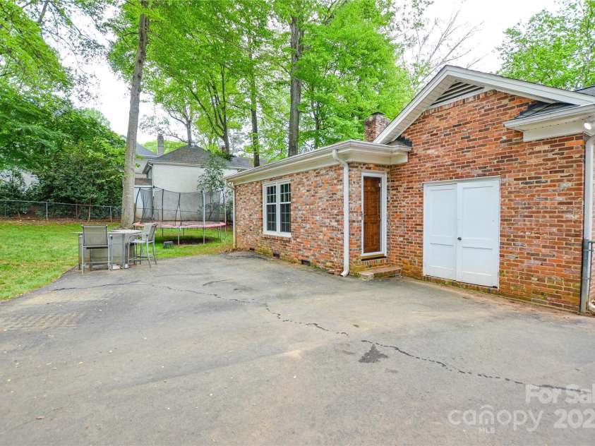 2429 Sugar Mill Road, Charlotte, NC 28210.  MLS# CAR4245721, YatesRealty ID 5405. View of the back of home showing the storage area and door leading into the Recreation room.