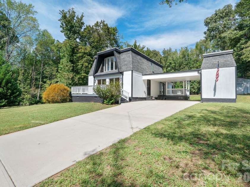 10111 Withers Road, Charlotte, NC 28278.  MLS# CAR4429841, YatesRealty ID 54055. Ample Driveway + Carport for Parking