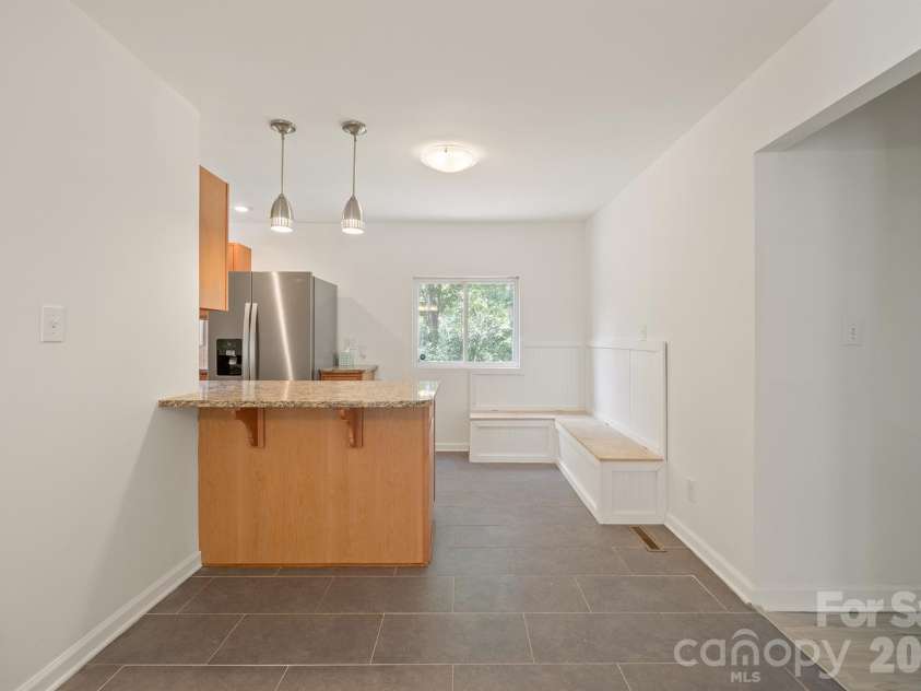 10111 Withers Road, Charlotte, NC 28278.  MLS# CAR4429841, YatesRealty ID 54055. Kitchen + Breakfast with Built in Bench