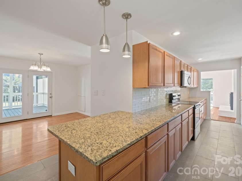 10111 Withers Road, Charlotte, NC 28278.  MLS# CAR4429841, YatesRealty ID 54055. Kitchen into Dining Room