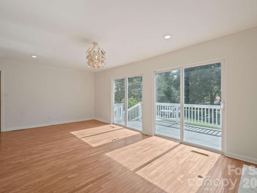 10111 Withers Road, Charlotte, NC 28278.  MLS# CAR4429841, YatesRealty ID 54055. Living Room with Front Deck Access