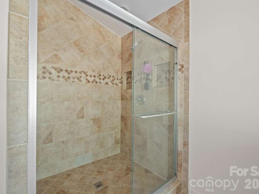 10111 Withers Road, Charlotte, NC 28278.  MLS# CAR4429841, YatesRealty ID 54055. Primary Bath Featuring Tile Shower