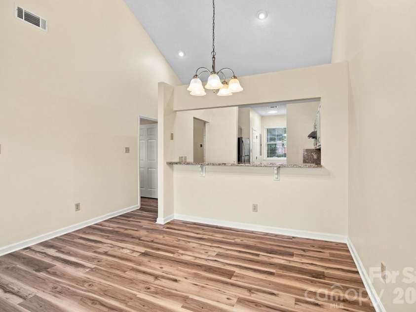 19838 Oak Leaf Circle, Cornelius, NC 28031.  MLS# CAR4429778, YatesRealty ID 54063. Dining area looking into the kitchen