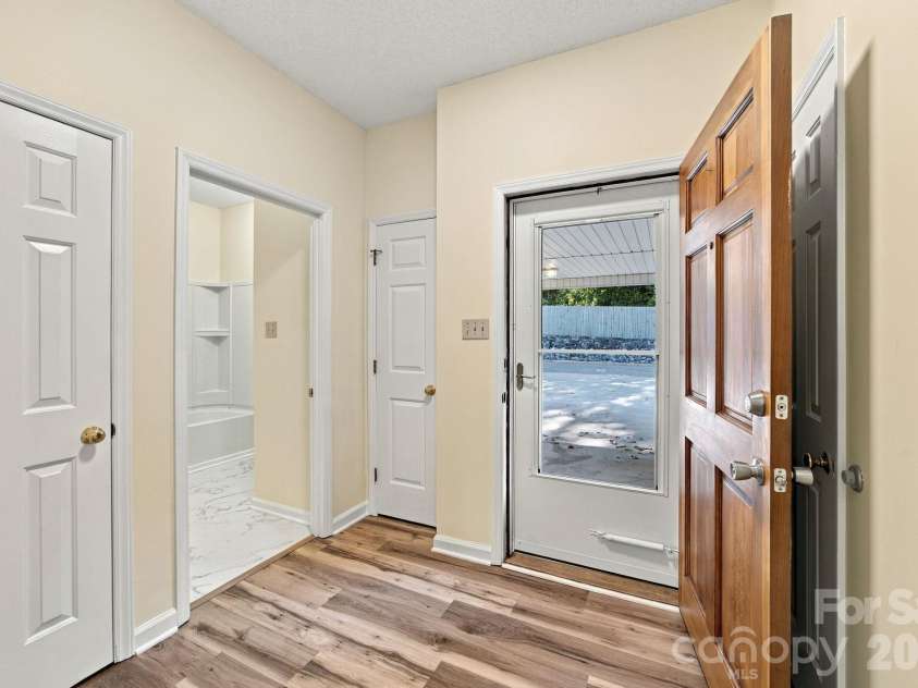 19838 Oak Leaf Circle, Cornelius, NC 28031.  MLS# CAR4429778, YatesRealty ID 54063. Front entry hallway and bathroom entrance