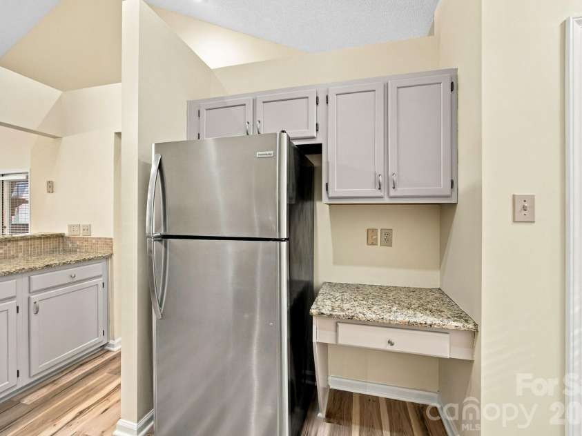 19838 Oak Leaf Circle, Cornelius, NC 28031.  MLS# CAR4429778, YatesRealty ID 54063. Kitchen and built in desk area