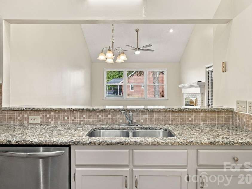19838 Oak Leaf Circle, Cornelius, NC 28031.  MLS# CAR4429778, YatesRealty ID 54063. Kitchen looking into dining area