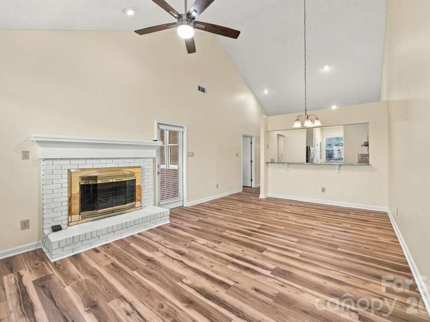 19838 Oak Leaf Circle, Cornelius, NC 28031.  MLS# CAR4429778, YatesRealty ID 54063. Living room and dining area