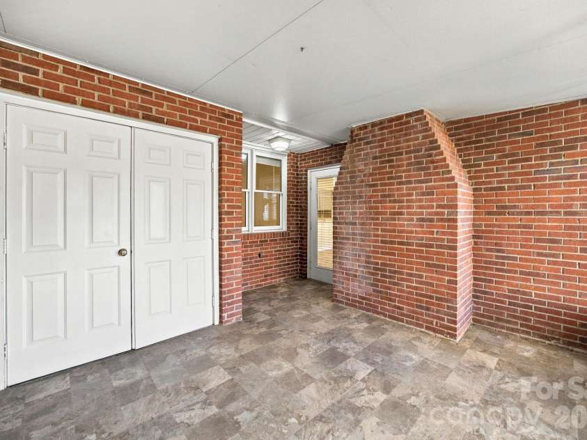 19838 Oak Leaf Circle, Cornelius, NC 28031.  MLS# CAR4429778, YatesRealty ID 54063. Screen porch and storage closet