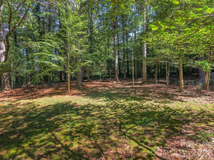 2509 Little River Road, Hendersonville, NC 28739.  MLS# CAR4429108, YatesRealty ID 54066. Back Yard