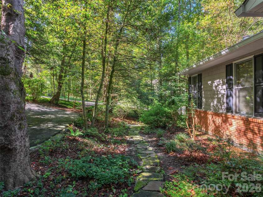 2509 Little River Road, Hendersonville, NC 28739.  MLS# CAR4429108, YatesRealty ID 54066. Pathway from Front Yard to Back