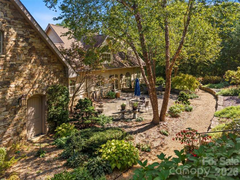 89 Emmas Grove Road, Fletcher, NC 28732.  MLS# CAR4430360, YatesRealty ID 54088. Back Terrace and Garden