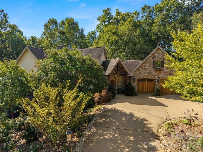 89 Emmas Grove Road, Fletcher, NC 28732.  MLS# CAR4430360, YatesRealty ID 54088. Front View Showing Circular Drive