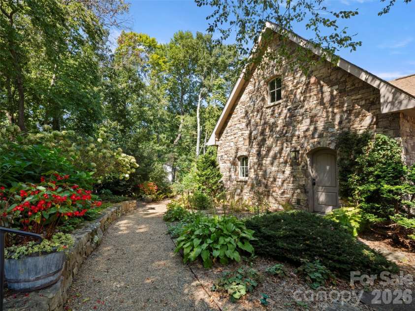 89 Emmas Grove Road, Fletcher, NC 28732.  MLS# CAR4430360, YatesRealty ID 54088. Side View with Garden Trails