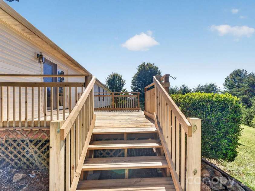 6041 Kaylas Ridge Road, Connelly Springs, NC 28612.  MLS# CAR4429448, YatesRealty ID 54091. From patio to deck