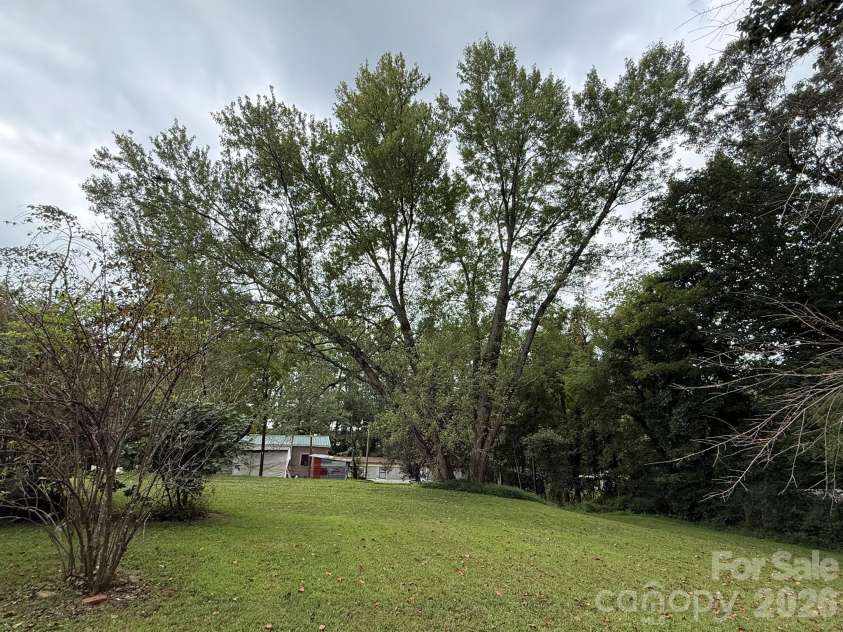 68 Morris Avenue, Marion, NC 28752.  MLS# CAR4422855, YatesRealty ID 54104. Backyard from the side