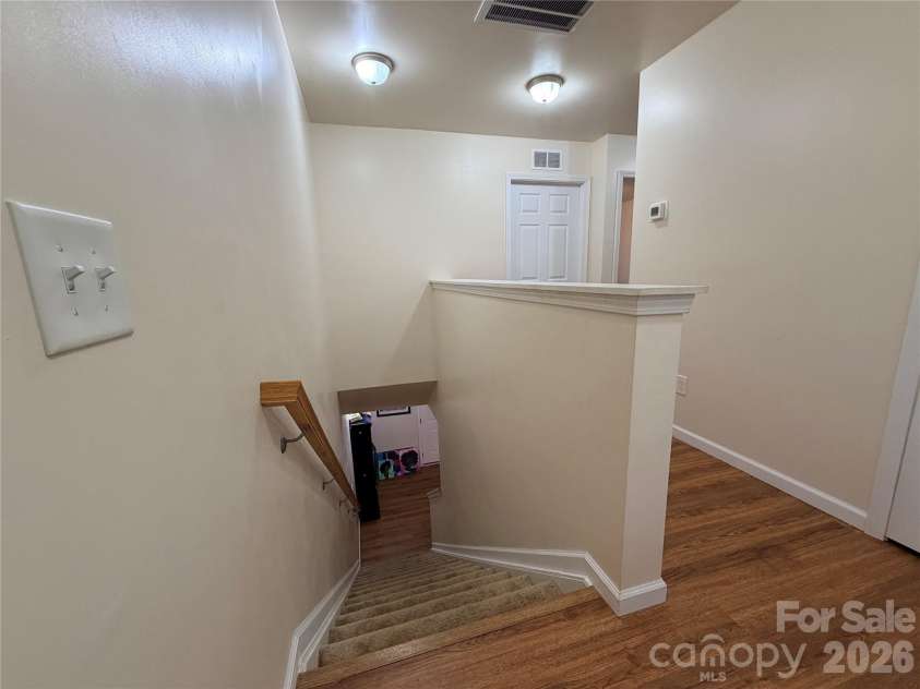 368 Mills Avenue, Mooresville, NC 28115.  MLS# CAR4416647, YatesRealty ID 54106. Upper level hallway